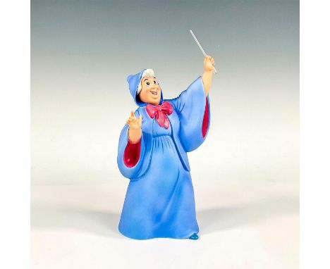 Porcelain figure with matte finish. Depicts the Cinderella's Fairy Godmother holding her magic wand up high. Walt Disney Clas