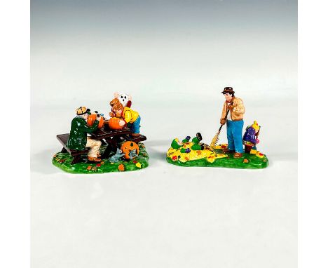 The Original Snow Village series; 2 ceramic hand painted figure. Includes a family at a picnic table sewing or carving pumpki
