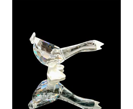 A clear faceted goose with black eyes. Frosted beak and feet. Swarovski mark. This item has its original box: 3.25"W x 2.5"H.