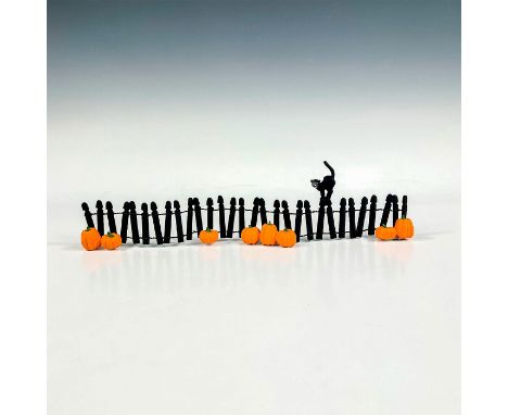 Part of the Village accessories, a wooden black painted fence with ceramic pumpkins. A black cat atop of the fence. Departmen