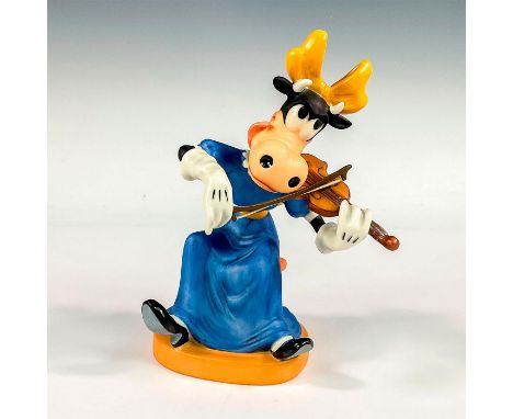 Porcelain figure with matte finish. Depicts Clarabelle from the 1942 short animation, Symphony Hour. Walt Disney Classic Coll