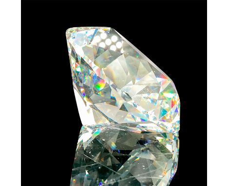 A clear faceted diamond figure. Swarovski mark. This item has its original box: 3.25"W x 3.25"H. Artist: Max SchreckIssued: 1