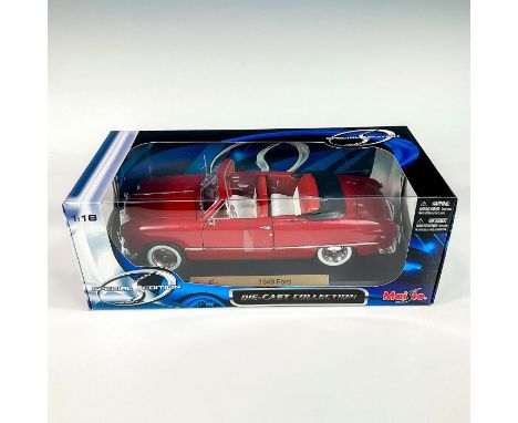 A factory sealed, replica die cast model Ford in a red exterior and white interior. With moveable parts. This item has its or