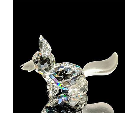 A clear faceted body of a fox running, with a frosted tail. Swarovski mark. This item has its original box: 3.25"W x 2.5"H. A
