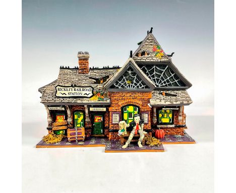 This collectible porcelain building designed for the Snow Village Halloween collection, depicts a vintage and weathered railr