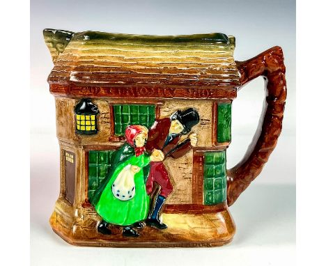 Glazed finish porcelain pitcher embossed with Little Nell and her grandfather. Royal Doulton backstamp. Dimensions: 6.5"L x 4