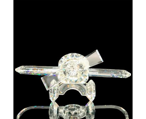 Clear crystal on body, wheels and propeller. Cut in seat. 7473 NR 000 002. Swarovski backstamp. This item has its original bo