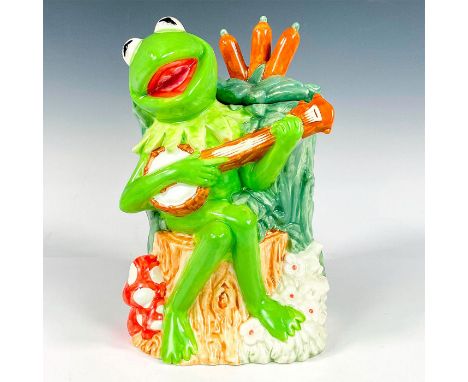 A large ceramic lidded jar modeled as Kermit strumming his old banjo singing happily sitting on a tree stump. Treasure Craft 