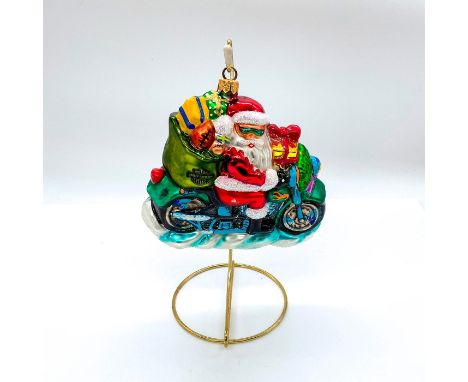 Depicts Santa Claus riding a motorcycle with Harley Davidson marked sack full of toys. Hand painted glass with glitter accent