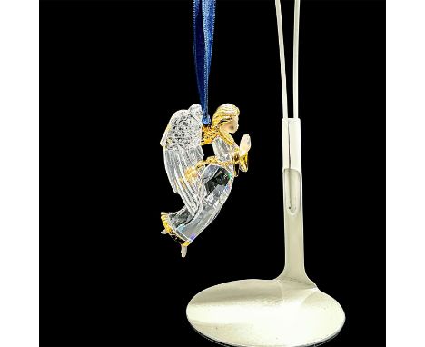 A beautiful clear angel with gold-tone metal accents. Swarovski impressed mark. This item has its original box: 4"L x 4"W x 3