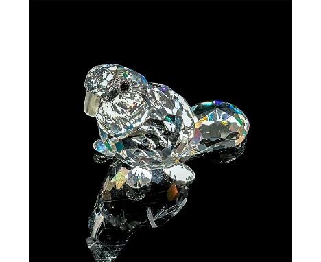 A clear faceted body with frosted teeth and black eyes. Swarovski mark. This item has its original box: 3.25"W x 2.5"H. Artis