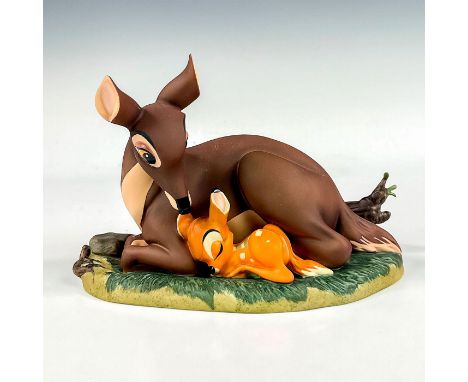 Porcelain figure with matte finish. From the 1942 animated film, Bambi, depicts Bambi with his mother. Includes a silver tone