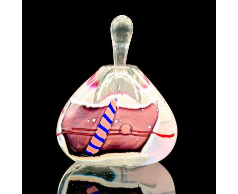 A glass perfume bottle that is decorated with abstract blue and pink artwork along with a glass stopper. James R. Wilbat sign