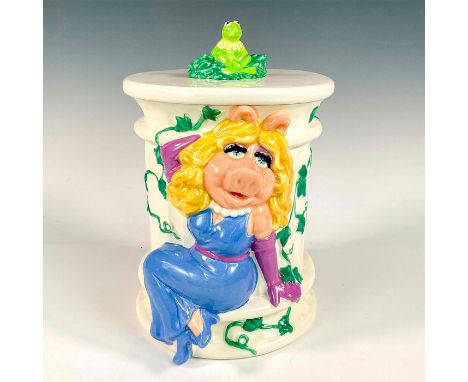 Large, ceramic lidded jar modeled as Miss piggy seated on a column with Kermit seated on lid. Treasure Craft impressed to lid