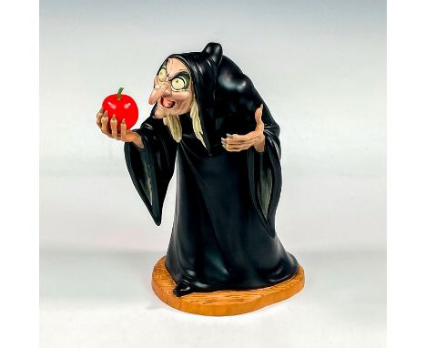 Porcelain figure with matte finish. From the 1937 animated film, Snow White, depicts the Evil Queen as an old hag. Includes a