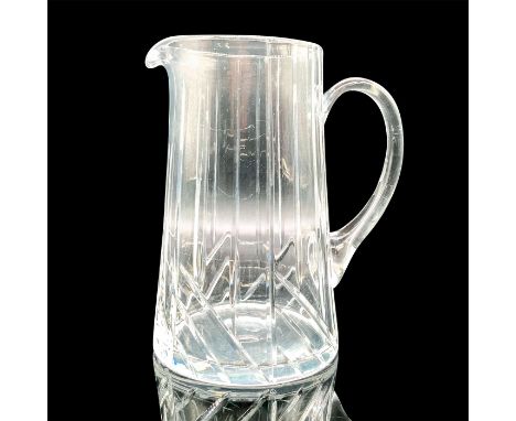 A clear crystal glass pitcher cut with high relief patterns. Illegible maker's backstamp. Dimensions: 6.5"L x 4.5"W x 7"HCond