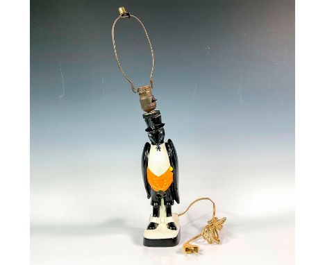A large table lamp that was a whiskey decanter, modeled as a stylized crow bird wearing a tuxedo. Royal Doulton backstamp. Di