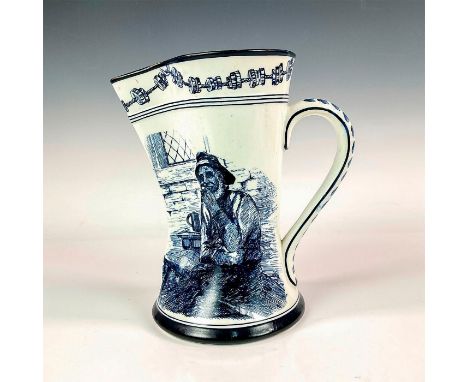 A blue Morrisian handled pitcher decorated in blue with a nautical scene and a sailor on white ground with gilded rim and han