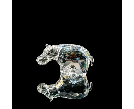 Brilliant clear crystal miniature hippo standing figurine. This item has its original box measuring 4"H x 3.5"D. Swarovski et