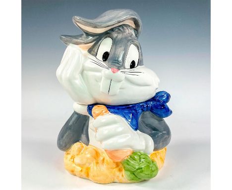 A ceramic lidded jar modeled as Bugs Bunny eating a large carrot, his favorite snack. Certified International Corps backstamp