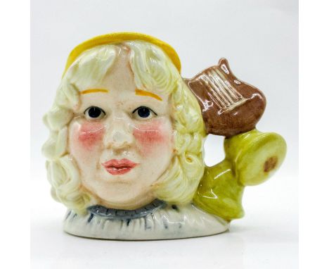 White, light brown, and yellow coloration.This jug was issued in the U.S.A. only, but made available to all members of the Ro