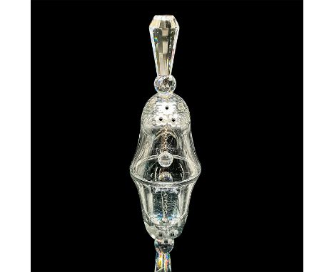 A clear bell adorn with frosted flowers with a black center. Swarovski mark. This item has its original box: 3.25"W x 6.25"H.