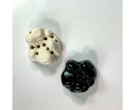 An unusual set of ceramic flower frogs in black and white coloration. Royal Doulton backstamp. Dimensions: 3.5"L x 3.25"W 2"H