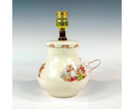 A lovely porcelain nursery lamp decorated with illustrations of a bunnykins family. Royal Doulton backstamp. Dimensions: 5.75