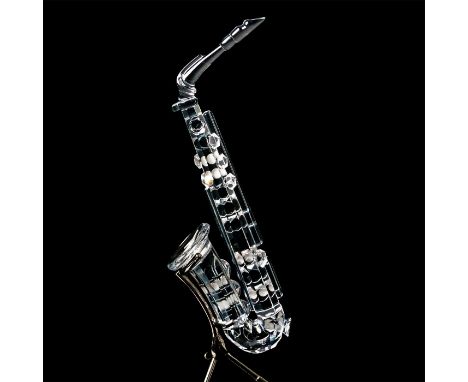 Musical instrument has clear body with pearl-colored note buttons. Silver stand. 7477 NR 000 007. Swarovski backstamp. This i