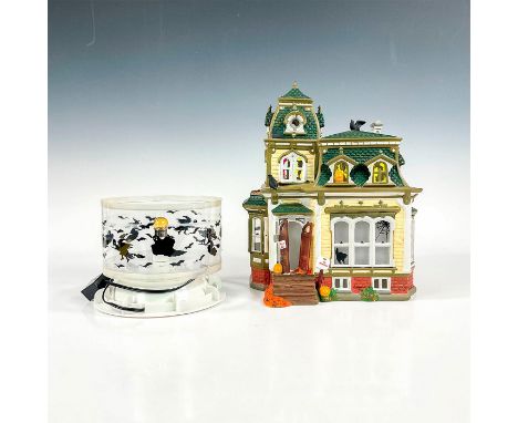 The Original Snow Village series; a ceramic hand painted figure of a spooky Victorian style house. Includes rotating projecti