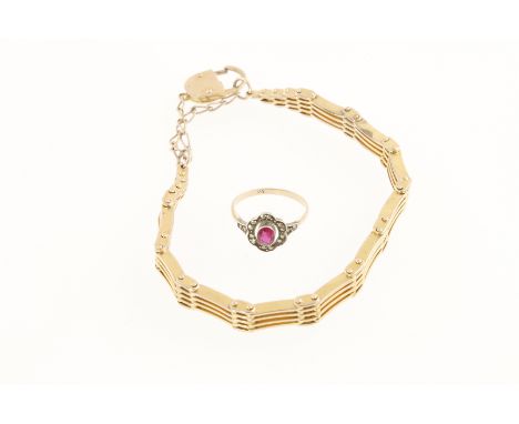A ladies gilt metal gate bracelet with padlock & a white & yellow metal red stone & marcasite ring, shank stamped 333, size N