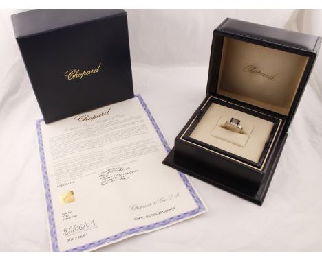 An 18ct white gold CHOPARD Happy Diamonds collection ring (Serial No 3156214) with original boxes and guarantee dated 2009, a