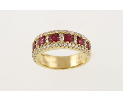A ruby and diamond set eternity ring, approx total diamond weight 0.50ct, stamped k18, size J