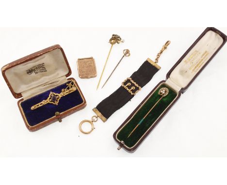 Items to declare three antique stick pins (two in cases). an amethyst set 9ct bar brooch, 9ct ladies black silk mounted alber