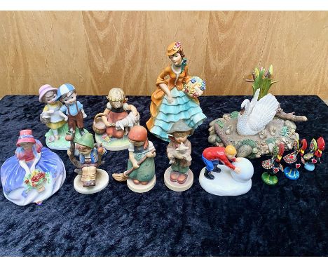 Collection of Goebel Figures, including an 8" figure of a lady with a basket of flower, four Goebel figures of children, Leon