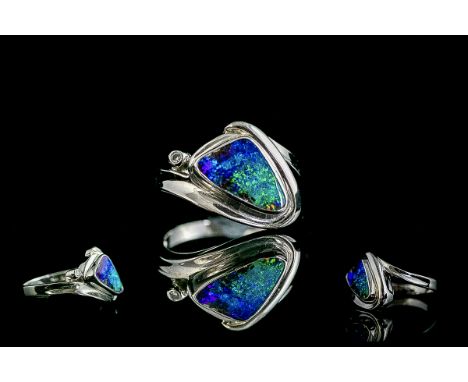 14ct White Gold Attractive Modern Designed Opal Set Dress Ring. Marked 14ct to Shank. The Australian Opal of Good Colours, Es