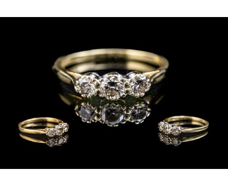 18ct Gold Attractive 3 Stone Diamond Set Ring. Marked 18ct - 750 to Shank. The 3 Round Brilliant Cut Diamonds of Excellent Co