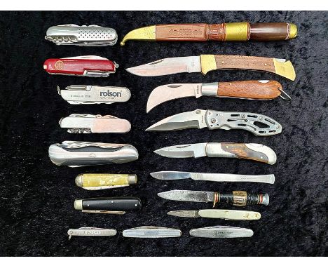 A Tin Containing a Collection of Pocket Knives and Swiss Army Knives, various designs.
