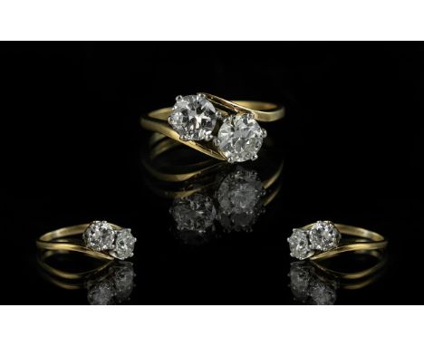 Ladies 18ct Gold Attractive 2 Stone Diamond Set Ring marked 750 to interior of shank. The two round brilliant cut diamonds of
