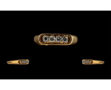 14ct Yellow Gold Attractive 4 Stone Diamond Set Ring marked 14ct to shank. The four round brilliant cut diamonds of good colo