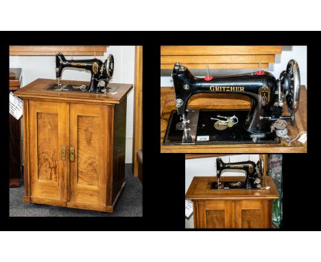 Vintage Gritzner German sewing machine housed in a wooden cabinet. Keys, Foot pedal, Instruction manual and Branded Tin with 