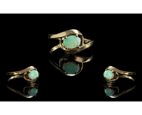 Ladies Attractive 9ct Gold Single Stone Opal Set Ring, full hallmark to shank, the oval shaped opals of good colour.  Ring si