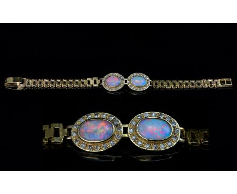 Ladies Attractive 9ct Gold Opal &amp; Diamond Set Bracelet.  The two central oval shaped opals of excellent multi-colours - o