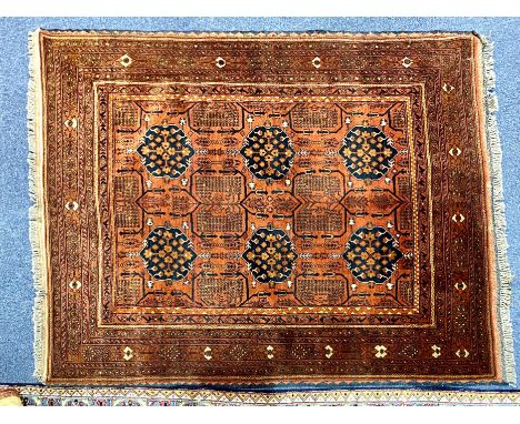 An Aztec Design Afghan Mahamadi Wool Rug, in shades of rust, brown and black, with fringed edges.  Central panel designs, mea