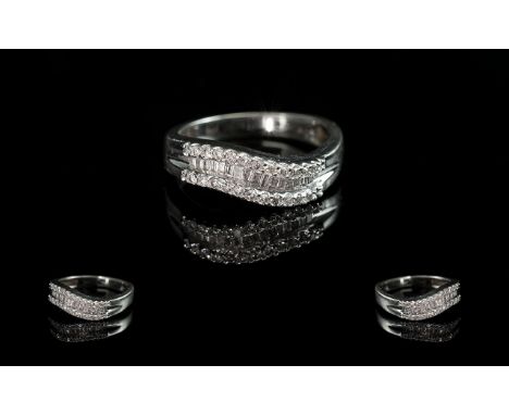 14ct White Gold Baguette and Brilliant Cut Diamond Set Ring. Marked 14ct to Ring. The Diamonds of Good Colour / Clarity. Est 
