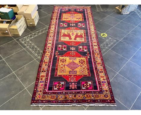 Deep Ground Rich Coloured Iranian Runner, unique medallion design depicting animals and vases.  Measures 219 x 118 cm.