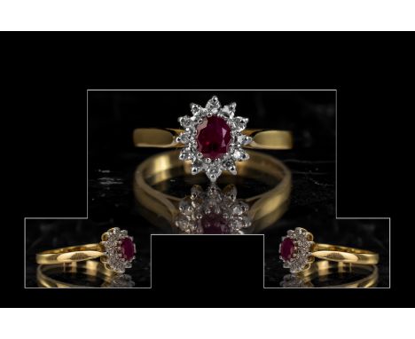 18ct Gold Attractive Ruby and Diamond Set Cluster Ring Flowerhead Setting. Full hallmark to interior of shank. The ruby and d