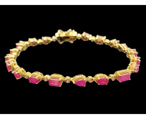 Multi- Cut Ruby Line Bracelet, the row of rubies, unusually, comprising an octagon, an oval, a round and a pear cut, repeated