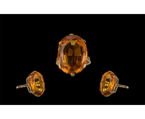 An Excellent 9ct Gold Orange Citrine Set Statement Ring the large faceted orange Citrine of excellent colour. Estimated weigh