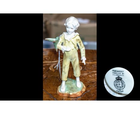 Royal Worcester Figure 'Parakeet' No. 3087, modelled by F C Doughty, figure measures 7'' tall.  Yellow costume, no damage.